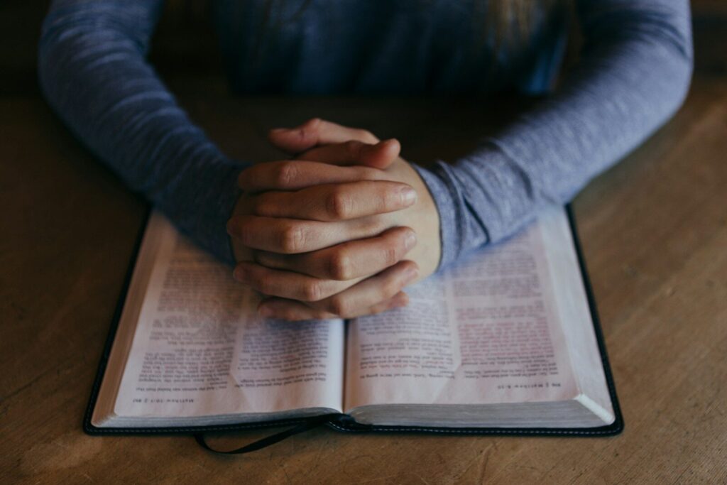 Man praying to resist temptations. Word Anchored